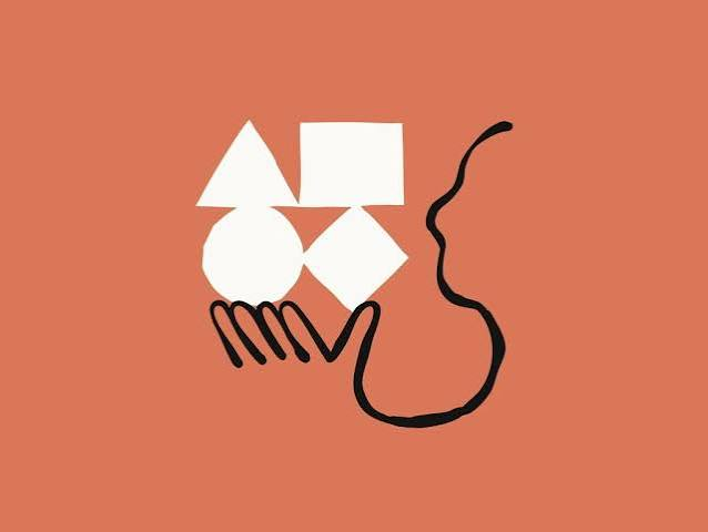 Hand holding abstract geometric shapes, representing Claude's reasoning